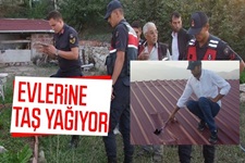 Evlerine taş yağıyor